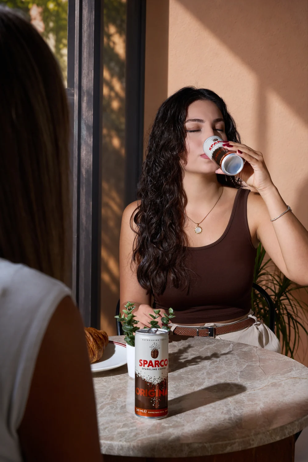 Woman enjoying an ice-cold Sparco